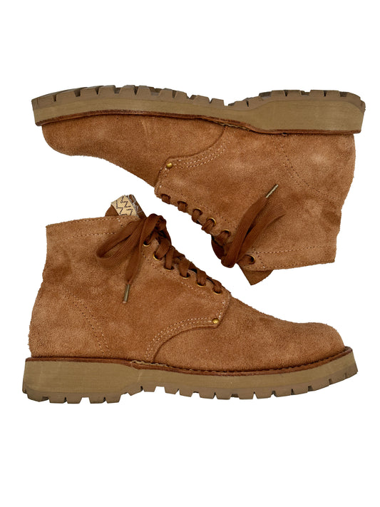 A pair of Visvim SS23 Brigadier Boots-Folk, in light brown suede with thick rubber soles, are stacked on top of each other against a white background.