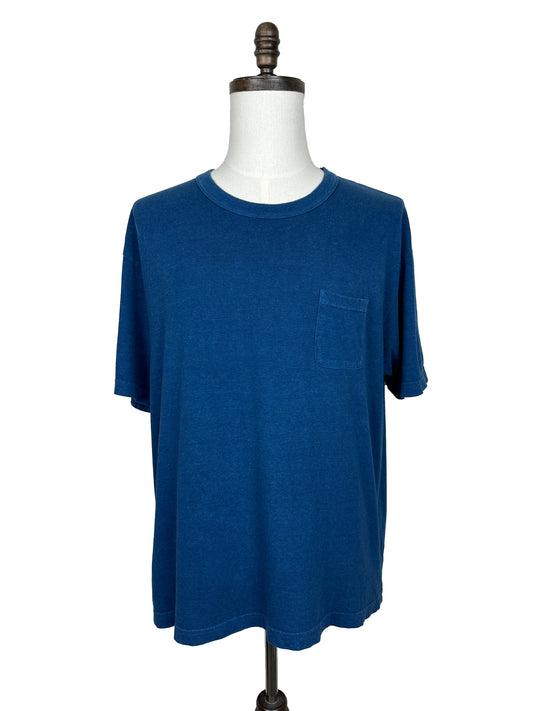The Visvim FW21 Amplus Tee S/S (N.D.), a plain blue short-sleeve t-shirt with a chest pocket made from Japanese cotton, is shown on a dress form against a white background.